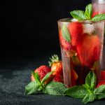 Fresh lemonade with ice, mint and strawberry.